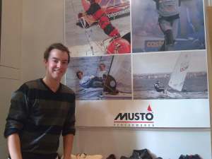 My brother Justin poses in front of Musto poster campaign